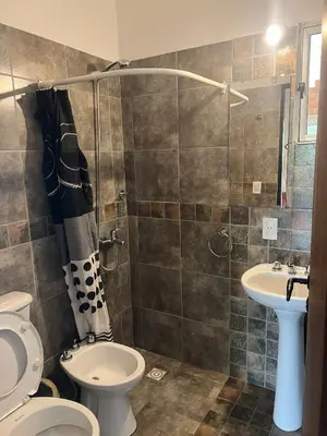 a bathroom with a toilet and a sink at Cobiche in Villa Larca