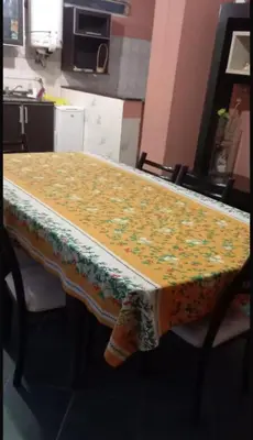 a table with a table cloth on it in a kitchen at casa carlos paz in Villa Carlos Paz