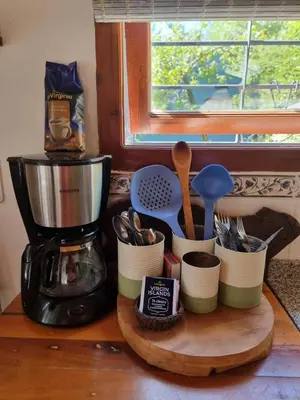 a kitchen counter with a coffee maker and utensils at Casitas Santa Elena in Trapiche