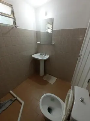 a bathroom with a toilet and a sink at Las Vertientes in Tanti