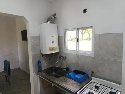 a kitchen with a sink and a window at Las Vertientes in Tanti