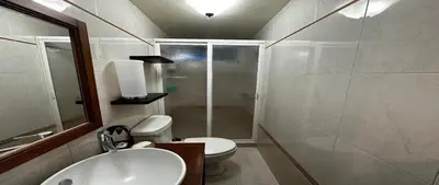 a bathroom with a toilet and a sink and a mirror at Alamos in Cordoba