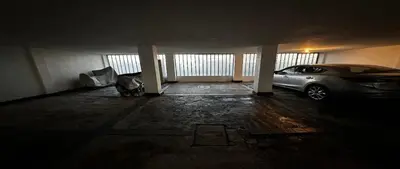 a garage with a car parked in it at Alamos in Cordoba
