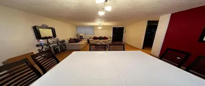 a living room with a large white table and chairs at Alamos in Cordoba