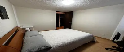 a small bedroom with a bed and a desk at Alamos in Cordoba