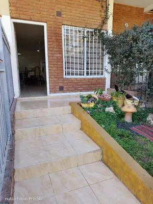 a patio with stairs leading into a house at Marcelina in Villa Carlos Paz