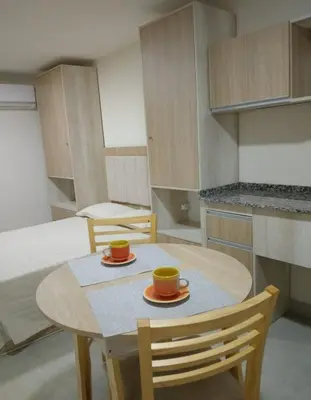 a kitchen with a table and two cups on it at La Pequeña Villa in Villa Carlos Paz