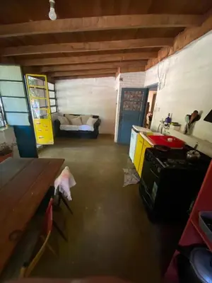 a living room with a couch in a garage at Casa Kuku in Las Rabonas
