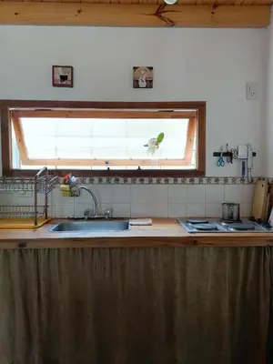 a kitchen counter with a sink and a window at Casita Santa Elena 1 in Trapiche
