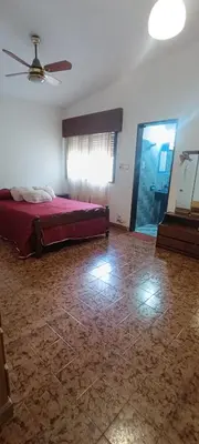 a bedroom with a bed and a ceiling fan at Casa Santa Rosa de Calamuchita in Cordoba