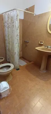 a bathroom with a shower and a toilet and a sink at Casa Santa Rosa de Calamuchita in Cordoba