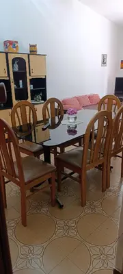 a dining room with a table and chairs and a couch at Casa Santa Rosa de Calamuchita in Cordoba