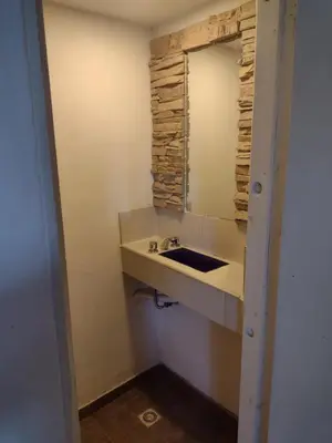 a bathroom with a sink and a mirror at Cabañas de San Antonio in San Antonio de Arredondo