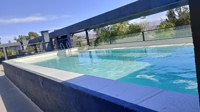 a large swimming pool on top of a building at Dpto Premium Frente al lago in Villa Carlos Paz