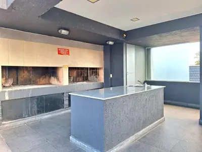 a lobby with a counter in a building at Dpto Premium Frente al lago in Villa Carlos Paz