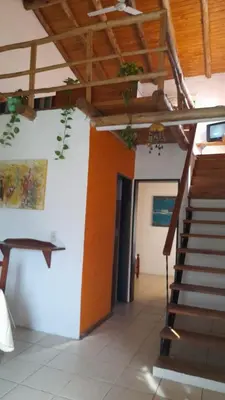 a hallway with a staircase in a building at Paraiso Cabañas in La Ramada