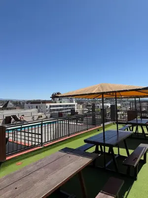 a picnic table on the roof of a building at Departamento en el Centro Completo, Cochera, Pile, Pile Clim in Villa Carlos Paz