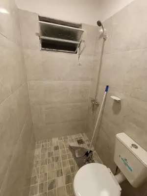 a small bathroom with a toilet and a window at Las Vertientes in Tanti