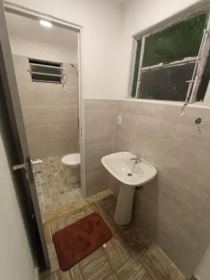 a bathroom with a sink and a toilet at Las Vertientes in Tanti