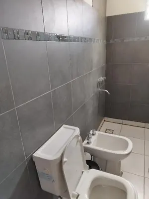 a bathroom with a toilet and a sink at Casa El Buen Descanso Cura Brochero in Villa Cura Brochero