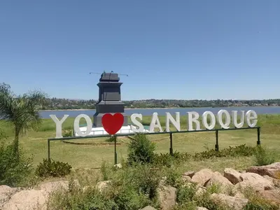 a sign that says you sanroute with a lighthouse at El Tito Alojamiento in San Roque