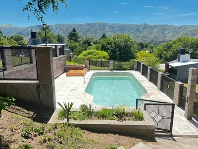 a swimming pool in the backyard of a house at Balcones de Bialet in Bialet Massé