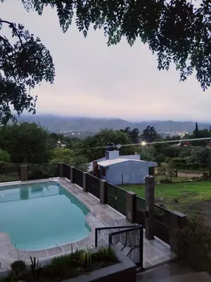 a swimming pool on top of a house at Balcones de Bialet in Bialet Massé
