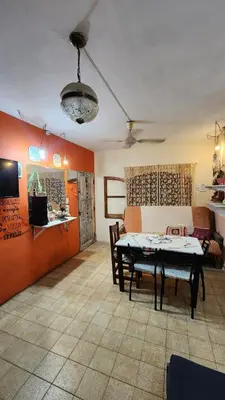 a living room with a table and a couch at Casa Céntrica a 4c del rio de 2 Dormitorios para 5 in Villa Carlos Paz