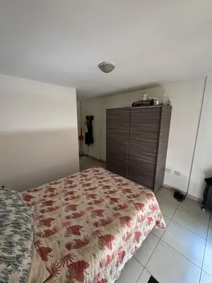 a bedroom with a bed and a dresser at El cercano a todo in Cordoba