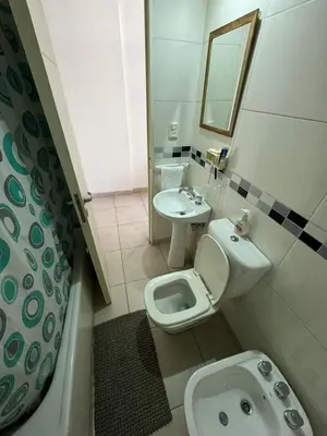 a bathroom with a toilet and a sink at El cercano a todo in Cordoba