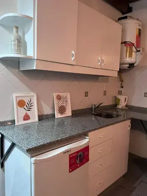 a kitchen with a counter with cards on it at Depto mini penthouse in Cordoba