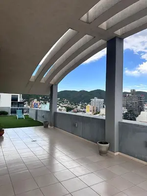 a balcony of a building with a view of a city at Depto centro in Villa Carlos Paz