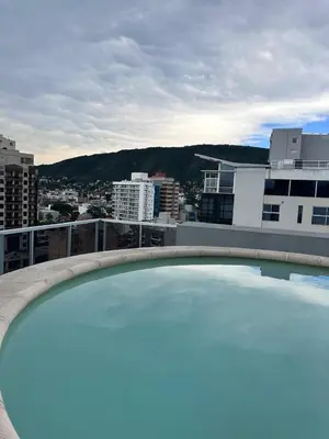 a large swimming pool on the roof of a building at Depto centro in Villa Carlos Paz