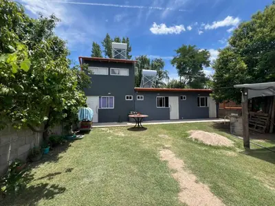 a view of a house with a yard at Monoambientes Pitu! in Villa Cura Brochero