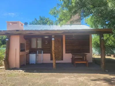 a small house with a porch and a table at Alma de Algarrobo in San Javier