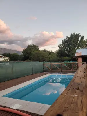 a swimming pool on top of a wooden deck at Alma de Algarrobo in San Javier