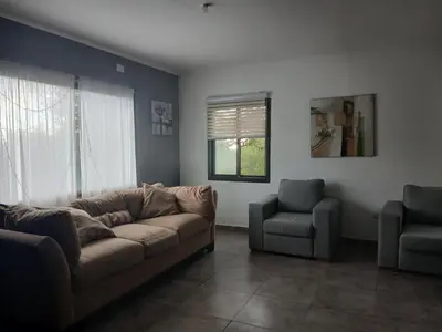 a living room with a couch and a chair at Torre Fuerte in Cerro de Oro