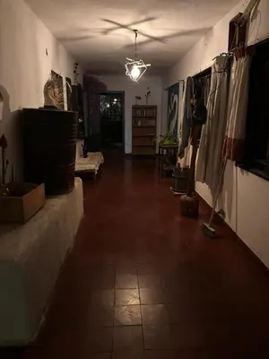 a hallway of a room with a ceiling at Kuku hostel in Las Rabonas