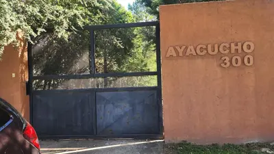 a garage door with a sign that reads avayaereo at Apart Playas de Oro in Villa Carlos Paz