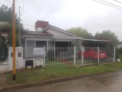 a white fence in front of a house at chalet los condores in Villa Carlos Paz