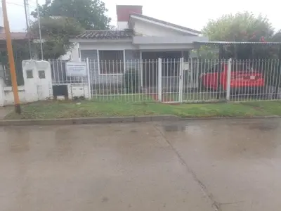 a white fence in front of a house at chalet los condores in Villa Carlos Paz