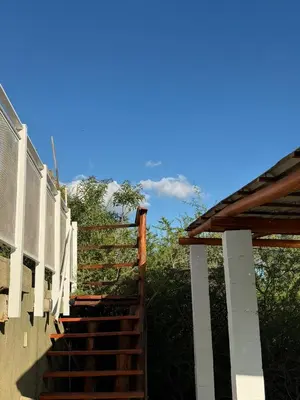 a set of stairs leading up to a building at Complejo turistico Alto del Valle in Villa Carlos Paz