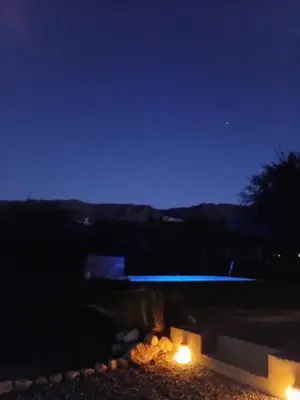 a night time view of a garden with lights at Lashara in Las Rabonas