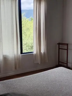 a bedroom with a bed and a window with a view at Lashara in Las Rabonas