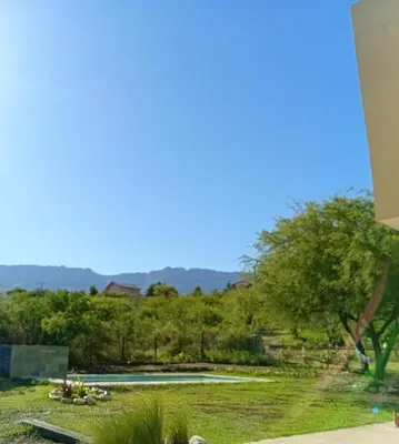 a view of a park with a pond at Lashara in Las Rabonas