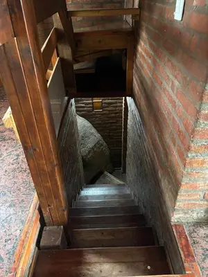 a set of stairs leading up to a building at Casa Numerosa Vista al lago con Pileta Villa Carlos Paz in La Porteña