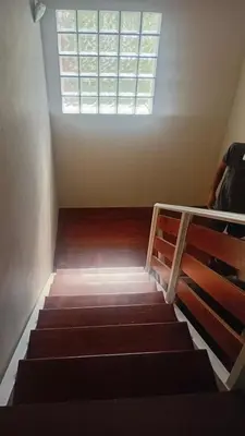 an empty room with stairs and a window at Alma Apart in Los Molles