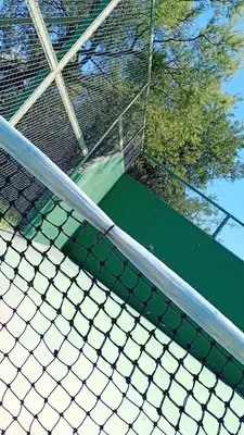 a tennis court with a net on top of it at Alma Apart in Los Molles