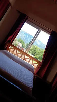 a window with a view of a mountain view at Alma Apart in Los Molles