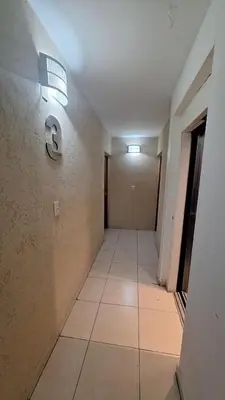 an empty hallway with a sign on the wall at 9 de Julio 460 in Villa Carlos Paz